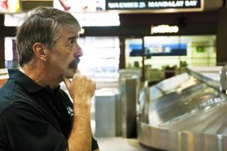 David Wolner of Las Vegas waits at McCarran International Airport for his brother Earl to arrive Tuesday, Nov. 22, 2011. David has not seen his brother in 34 years and eagerly awaits this long anticipated reunion.