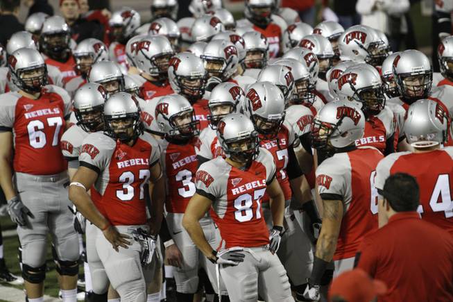 Rebel players prepare to warm up before their game against San Diego State on Saturday, Nov. 26, 2011, at Sam Boyd Stadium.