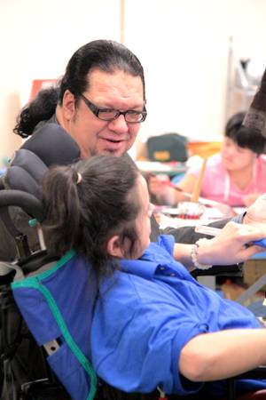 After advancing to another round on "Celebrity Apprentice," Penn Jillette visits Opportunity Village to deliver a check worth $40,000 earned from his wins on the show.