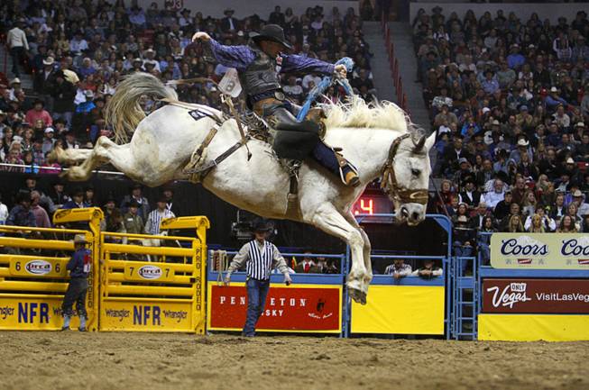 Saddle bronc rider Jesse Bail of Camp Crook, S.D. competes during the first go-round of the National Finals Rodeo at the Thomas and Mack Center Thursday, December 1, 2011.