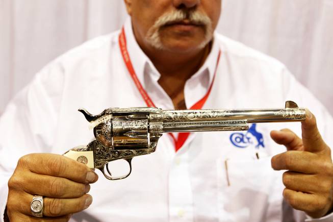 A Colt single action army six shooter with engraving at the Colt booth at the Cowboy Christmas Gift Show at the Las Vegas Convention Center in Las Vegas Thursday, Dec. 1, 2011.