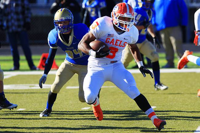 Bishop Gorman running back Shaquille Powell looks for running room in the Reed High School defensive line during the 4A championship football game Saturday, Dec. 3, 2011 at Damonte Ranch High School in Reno. Gorman won their third consecutive title 72-28.