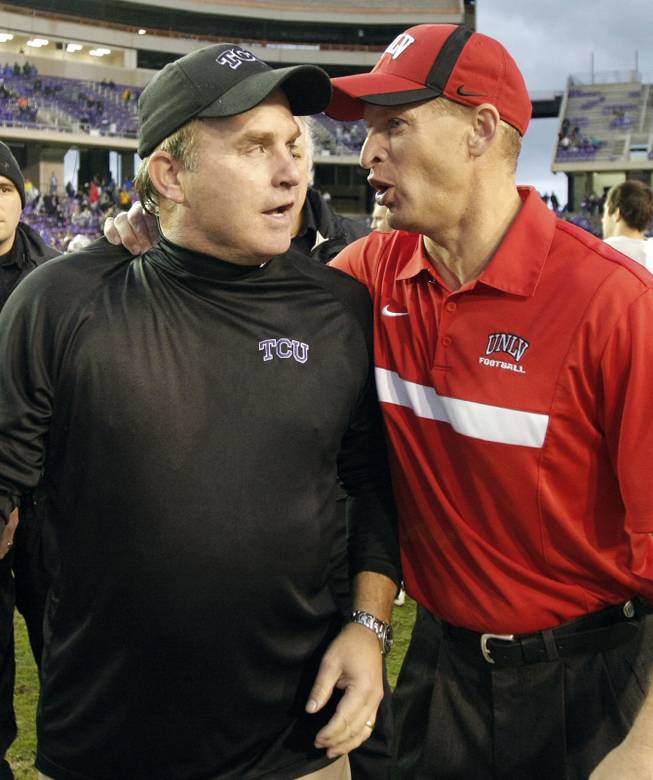 TCU head coach Gary Patterson, left, and UNLV head coach Bobby Hauck greet each other after their game in Fort Worth, Texas. TCU won 56-9. 