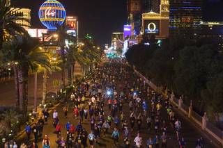 Runners head northbound on the Las Vegas Strip during the Zappos.com Rock 'n' Roll Las Vegas Marathon Sunday, December 4, 2011. The marathon and half-marathon attracted 44,000 official entrants from all 50 states and 54 countries, organizers said.