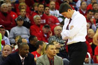UNLV head coach Dave Rice looks down while walking along the bench during their game against Wisconsin at the Kohl Center in Madison Saturday, Dec. 10, 2011. Wisconsin won the game 62-51, dropping UNLV to 9-2 on the season.