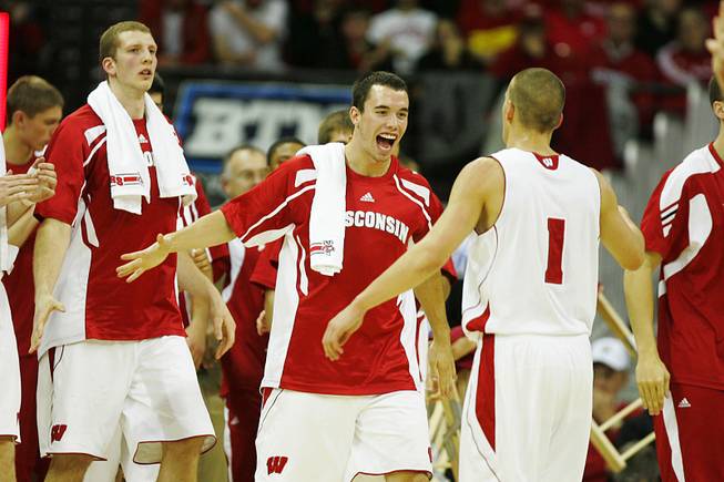 Wisconsin guard Dan Fahey celebrates with teammates as they head to the bend for a time out during their game against UNLV at the Kohl Center in Madison Saturday, Dec. 10, 2011. Wisconsin won the game 62-51, dropping UNLV to 9-2 on the season.
