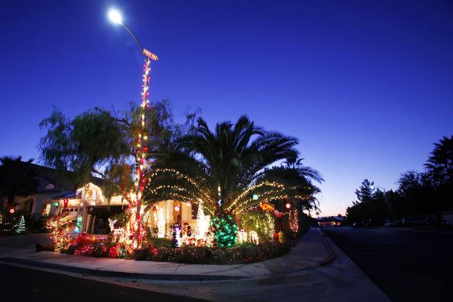 Dennis and Susan Thomas' home in Henderson, seen on Wednesday, Dec. 14, 2011, won first place in the "Griswold" category for the City of Henderson's holiday light contest.