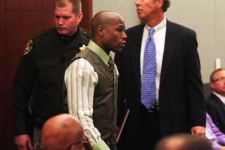 Boxer Floyd Mayweather Jr. arrives in court to plead guilty on domestic violence charges Wednesday, Dec. 21, 2011 at the Clark County Regional Justice Center. Mayweather received a six month sentence and will have to spend 90 days in jail.