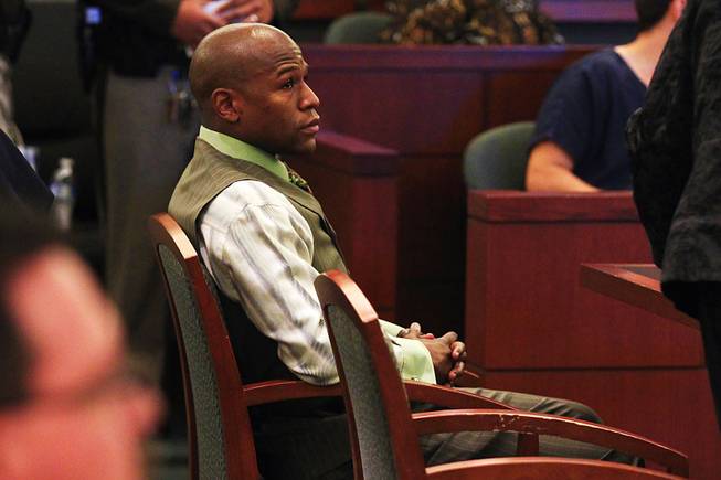 Boxer Floyd Mayweather Jr. appears in court to plead guilty on a domestic violence charge Wednesday, Dec. 21, 2011, at the Clark County Regional Justice Center. Mayweather received a six-month sentence and will have to spend 90 days in jail.