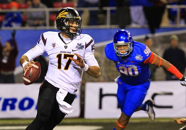 Arizona State quarterback Brock Osweiler is pressure by Boise State's ...