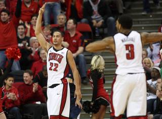 UNLV's Chace Stanback signals after hitting a 3-pointer in the first half of the Rebels' game against California on Friday, Dec. 23, 2011.
