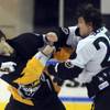 Thunder winger Bretton Cameron recoils after taking a right hand from Wranglers defenseman Channing Boe during a third-period fight Wednesday morning at the Orleans Arena.