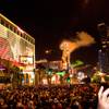 Crowds watch and react to the fireworks display above the Strip on New Year's Eve, Saturday, Dec. 31, 2011.