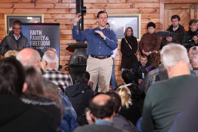 Republican presidential candidate Rick Santorum speaks to a crowd gathered at the Merrimack Valley Railroad Company in Northfield, N.H. on Thursday.
