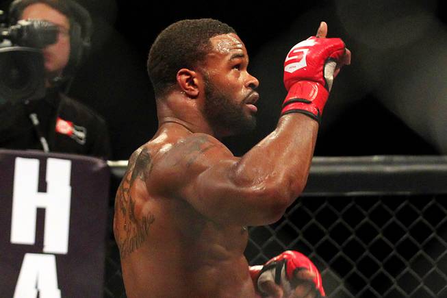 Tyron Woodley points up after defeating Jordan Mein during their fight on the Strikeforce card Saturday, Jan. 7, 2012 at the Hard Rock.