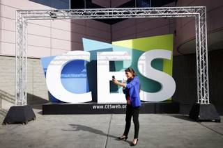Belgian journalist Tatiana Silva records a stand up with a smart phone during the Consumer Electronics Show outside of the Las Vegas Convention Center on Monday, Jan. 10, 2012.