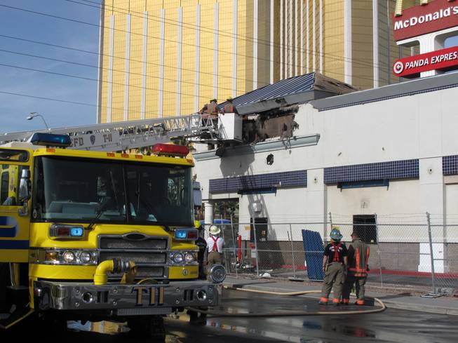 Clark County firefighters responded to a two-alarm fire Monday morning at the McDonald's located across the street from Mandalay Bay. No one was injured.