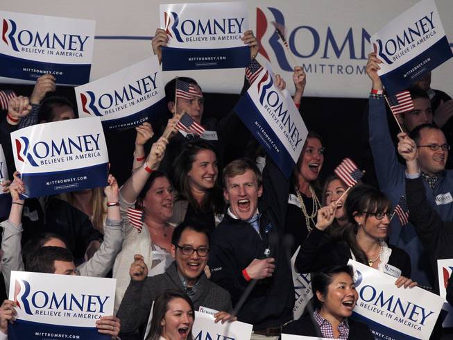 Supporters at the Romney for President primary-night rally at Southern New Hampshire University in Manchester, N.H., Tuesday, Jan. 10, 2012, cheer as it is announced that the election has been called for former Massachusetts Gov. Mitt Romney.