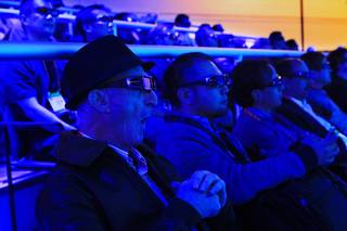 Harold Morley joins others in watching a demonstration of Panasonic's 3D technology during the 2012 Consumer Electronics Show Tuesday, Jan. 10, 2012.