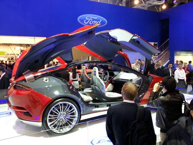 Ford's EVOS concept car sports doors that open up, and a modern, spartan interior.