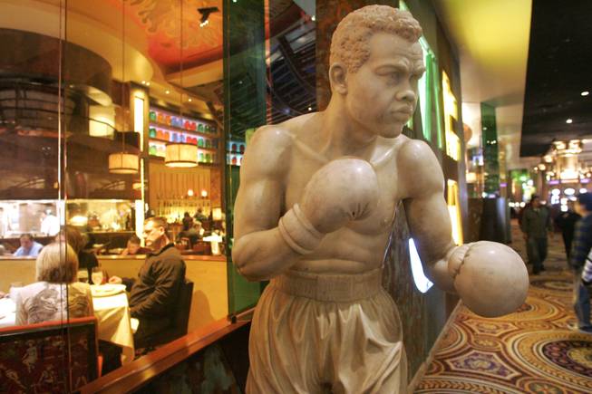 A statue of boxing legend Joe Louis stands outside Caesars Palace's race and sports book.