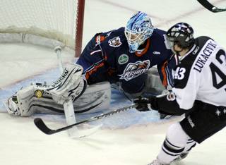 Ontario netminder Chris Carozzi gets a pad on a shot by Ned Lukacevic as the Wranglers hosted the Reign on Friday night at the Orleans Arena.