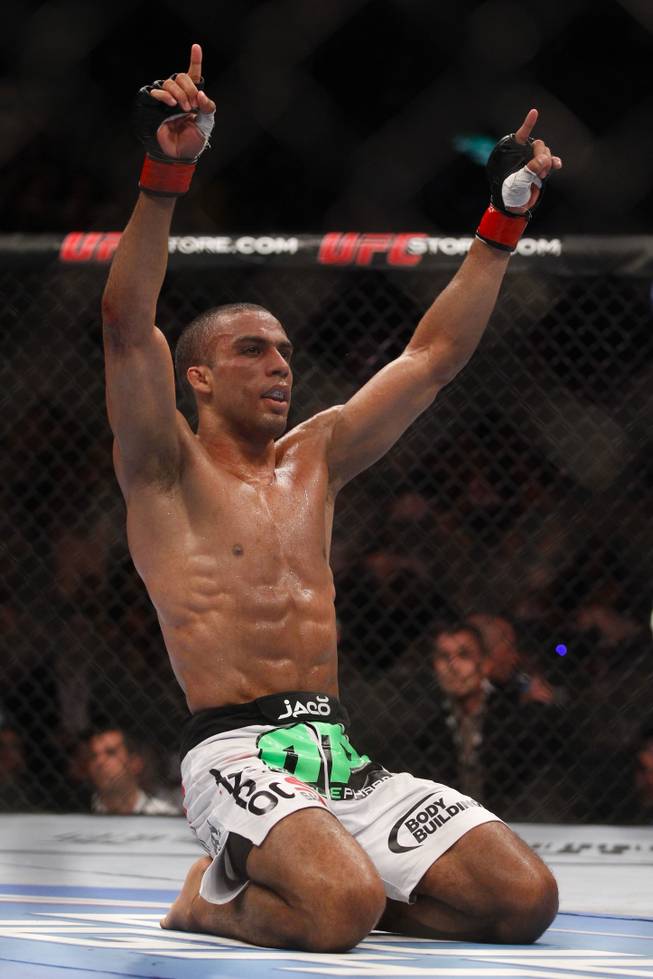 Edson Barboza, from Brazil, celebrates after defeating Terry Etim, from the UK, during their lightweight mixed martial arts bout at UFC 142 in Rio de Janeiro, Brazil, Sunday, Jan. 15, 2012.