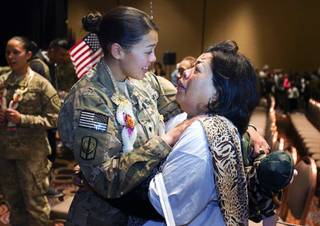 Wimon Thompson weeps tears of joy as she hugs her daughter Army Guard Spc. Crystal Sanchez following a welcome home ceremony for the 422nd Expeditionary Signal Battalion at the Mandalay Bay Sunday, January 15, 2012. The Army National Guard soldiers entered field service on January 7, 2011 and have been serving in Afghanistan since March 28, 2011.