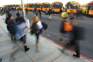 Students make their way to buses after classes at Del Webb Middle School Tuesday, Jan. 17, 2012.