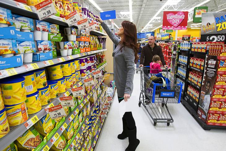 Stephanie Deppensmith, her husband Alex Karvounis and daughter Harper Karvounis, 22 months, go grocery shopping at Walmart Sunday, Jan. 22, 2012. 