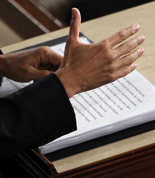 President Barack Obama gestures while delivering his State of the Union  address on Capitol Hill in Washington on Jan. 24, 2012.