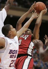 UNLV's Anthony Marshall (3) has his shot blocked by Boise State's Ryan Watkins (23) during the first half of an NCAA college basketball game on Wednesday, Jan. 25, 2012, in Boise, Idaho. (AP Photo/Matt Cilley)