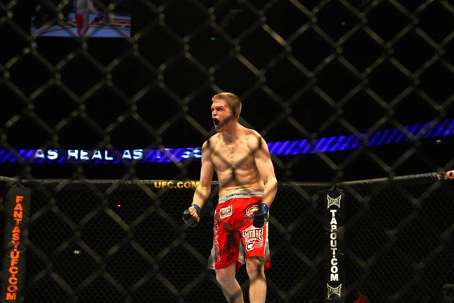 Evan Dunham celebrates a win over Per Eklund in a bout at a UFC event at the O2 Arena, London, Saturday, Feb. 21, 2009. Dunham won via 1st round TKO.