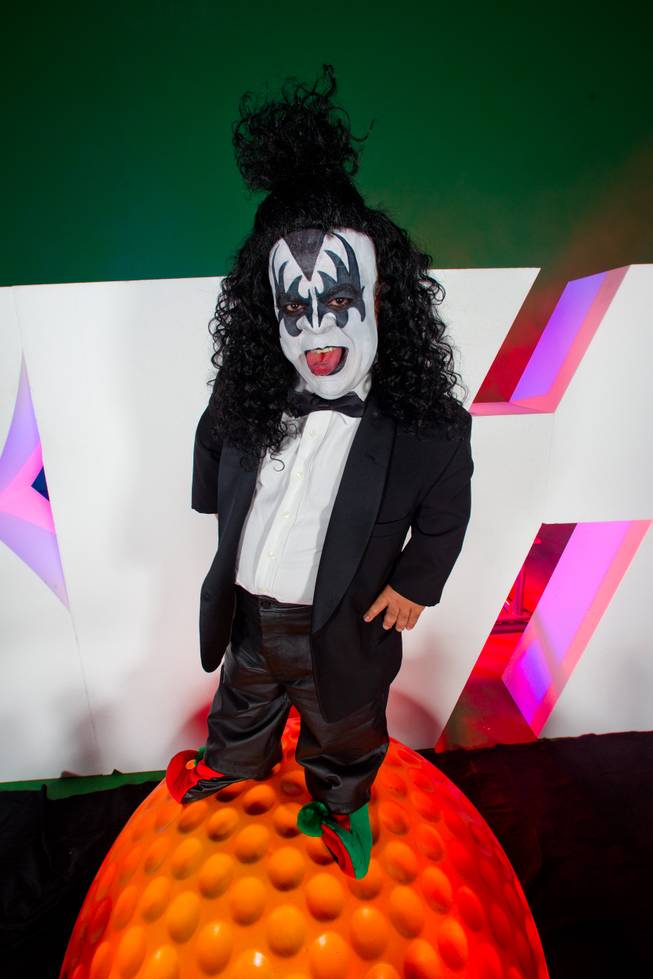 KISS By Monster Mini Golf Spokesman Brian "Lowercase g" Thomas, standing atop a very large golf ball.