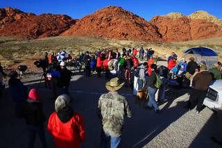 Some of an estimated 150 volunteers assemble in Calico Basin to search for missing outdoorsman and athlete Ron Kirk Saturday, Jan. 28, 2012.