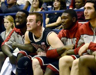 UNLV players react from the bench during overtime of the Rebels' 65-63 win Saturday, Jan. 28, 2012, at Air Force.