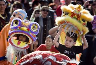 Caitlin Lamug, left, 7, and Antonio Aja, 5, perform a lion dance during the 18th Chinese New Year Celebration & Festival at the Chinatown Mall Sunday, Jan. 29, 2012. The festival was organized by the Chinese Chamber of Commerce and the Chinatown Mall.