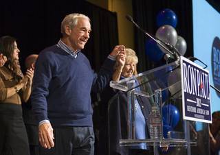 Republican presidential candidate Rep. Ron Paul, R-Texas, and his wife, Carolyn, arrive for a rally at the Green Valley Ranch Resort in Henderson on Tuesday, Jan. 31, 2012. 