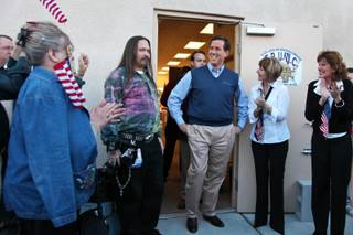 Republican presidential candidate former Pennsylvania Sen. Rick Santorum, center, chats with supporters before a rally outside his Nevada headquarters in Las Vegas on Tuesday, Jan. 31, 2012.