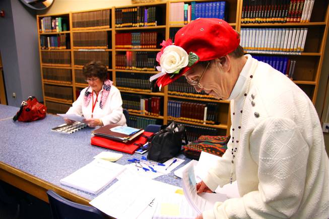 Precinct 7554s Sharon Peterson, caucus director, and Sue Garbat, the caucus assistant, sort through paperwork in the library of Boulder City High School prior to starting the Republican caucus in Boulder City on Saturday, Feb. 4, 2012.