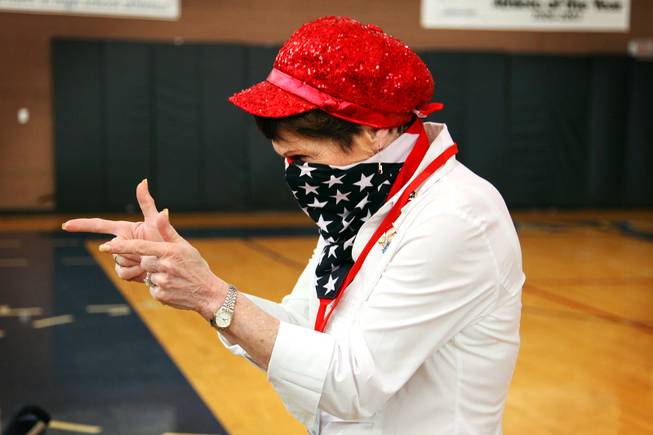 Bev Mazza, a caucus volunteer, has a little bit of fun with her American flag scarf as the caucuses at Boulder City High School wind down on Saturday, Feb. 4, 2012.