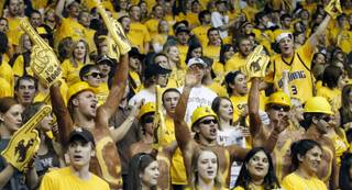 Wyoming fans cheer during the Cowboys' game Saturday, Feb. 4, 2012, against UNLV in Laramie, Wyo.