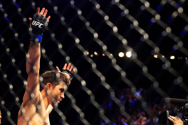 Carlos Condit raises his arms after being introduced before his interim welterweight championship bout against Nick Diaz Saturday, Feb. 4, 2012 at the Mandalay Bay Events Center. Condit won a unanimous decision and will likely face Georges St. Pierre in November.