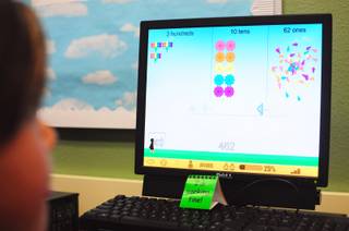 Sewell Elementary School student works through a lesson on place values using the 