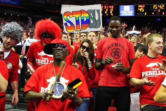 Rapper Flavor Flav joins the UNLV student section during their Mountain West Conference game  against San Diego State Saturday, Feb. 11, 2012 at the Thomas & Mack Center. UNLV won the game 65-63.