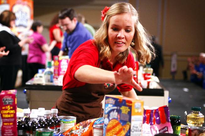 Alisha McCrohan of Hannaford Bros. in Massachusetts competes during the Best Bagger Championship, part of the National Grocers Association's Annual Convention at the Mirage in Las Vegas on Monday, Feb. 13, 2012.