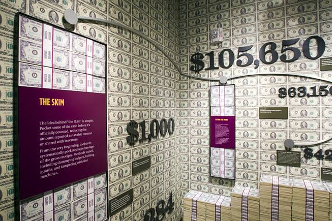 Stacks of fake money are displayed in the "Skim Room" at the Mob Museum in downtown Las Vegas Monday, Feb. 13, 2012. The Skim Room details how mobsters skimmed money (pocketing money before it was officially counted) from Las Vegas casinos. The museum, in a renovated former federal courthouse and U.S. Post Office, will have its grand opening Tuesday.