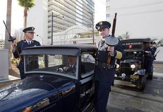 Members of the San Diego Police Museum Association pose on a 1928 Ford Model A before the Mob Museum's grand opening in downtown Las Vegas, Tuesday February 14, 2012. The building, a former federal courthouse and post office, was completed in 1933 and is listed on the Nevada and National Registers of Historic Places. It is also one of 14 sites in the nation that hosted the 1950-51 U.S. Senate Special Committees to investigate Crime in Interstate Commerce, also known as the Kefauver hearings.