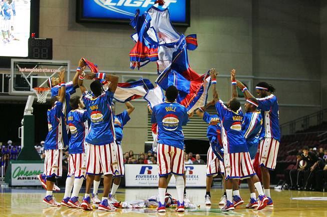 The Harlem Globtrotters throw their warm ups in a pile at the Orleans Wednesday, Feb. 15, 2012.