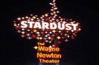 A photo of the old Stardust sign advertising the Wayne Newton Theater.